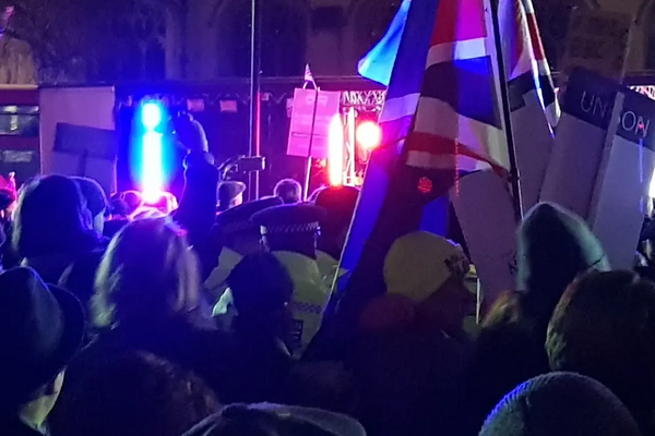 Pro-Brexit supporters walk through the Remain rally