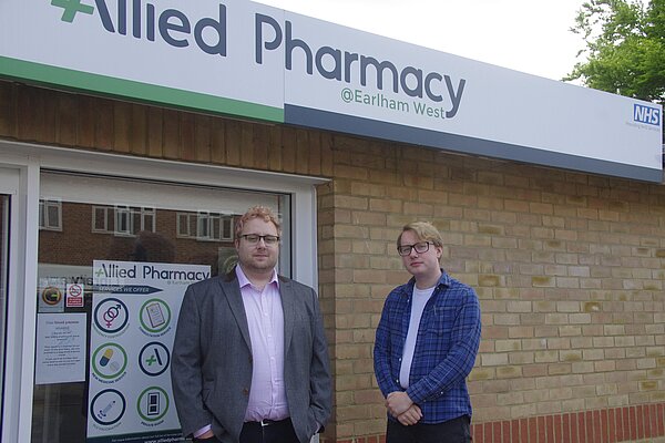 Sean Bennett and James Hawketts in front of the West Earlham Pharmacy.